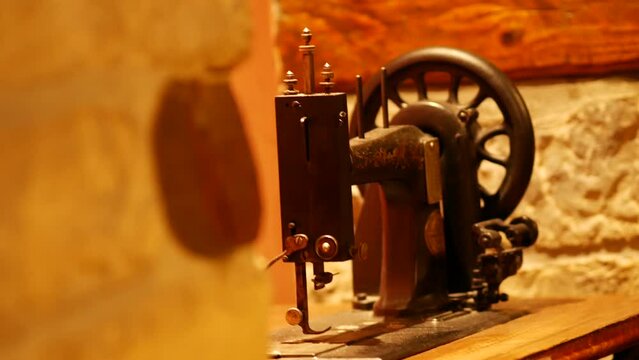 Vintage foot operated mechanical sewing machine from the late 19th century. Antique Seidel and Naumann Hand crank Transverse Shuttle Sewing machine. Istria, Croatia - November 25, 2023