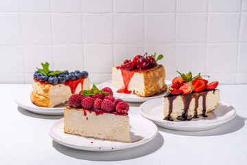 Summer cheesecake slices with various berry