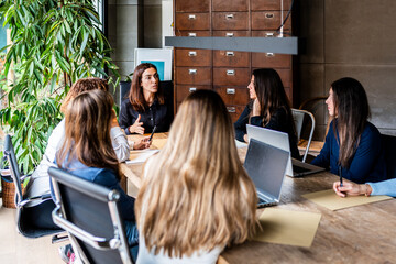 Women's meeting in modern office setting