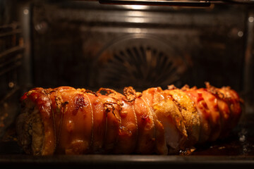 Baked pork wrapped in a roll. Pork roll close-up.