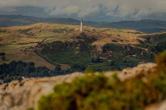 View towards the distant Sir John Barrow Monument situated on Hoad Hill, Ulverston, taken from Birkrigg Common, Ulverston, Cumbria, England