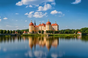 Fototapeta premium Beautiful view of Moritzburg Castle on the shore of a serene lake. Saxony, Germany