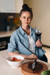 Solitude and Sip: A Pretty Caucasian Woman Enjoying Wine Alone at Home, Reflecting Elegance and Relaxation in Stylish Interior