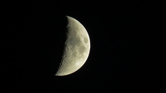 Fototapeta zoom on the moon on black background with craters
