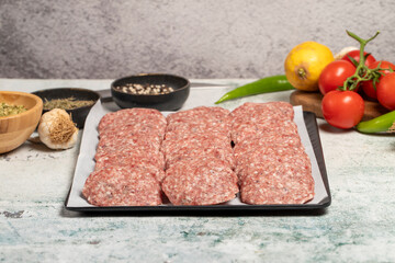 Beef meatballs. Butcher products. Raw beef meatballs on stone background