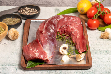 Beef Tenderloin. Butcher products. Raw beef tenderloin on stone background