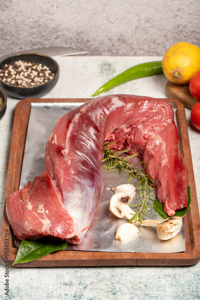 Wall mural beef tenderloin. butcher products. raw beef tenderloin on stone background