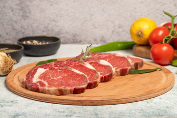 Beef entrecôte or ribeye. Butcher products. Raw beef ribeye on stone background