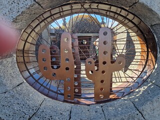Cacti from Lanzarote flourish in its arid climate, showcasing diverse shapes and sizes. Against the volcanic terrain, their striking silhouettes add a unique charm to the landscape.