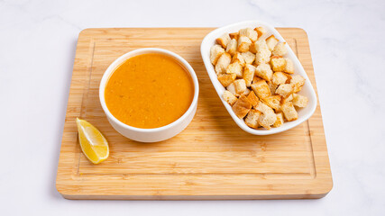 Lentil soup bowl with crackers