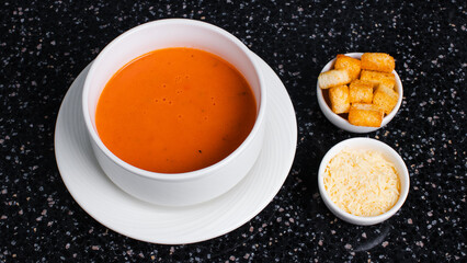 Tomato soup bowl with crackers