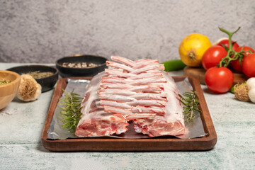 Lamb chops or lattice. Butcher products. Unsliced raw lamb chops on stone background