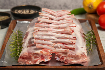 Lamb chops or lattice. Butcher products. Unsliced raw lamb chops on stone background