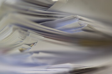 Stack of papers, files, data, archives, profiles and other documentation in the office.