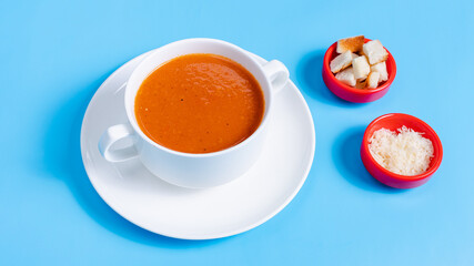 Tomato soup bowl with crackers