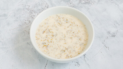 Fototapeta na wymiar Dovga soup - Azerbaijan yogurt soup bowl