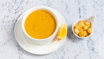 Lentil soup bowl with crackers