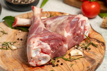 Lamb's shank. Butcher products. Lamb shank steak with bones on stone background