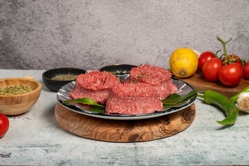 Ground beef. Butcher products. Raw ground beef on stone background
