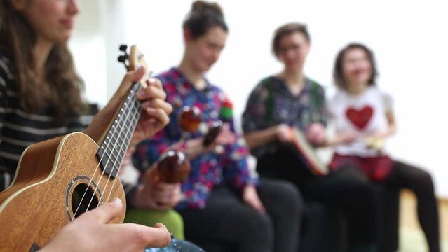 Music therapy concept, a group of people playing different types of musical instruments, music and sound healing