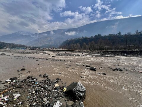 Beas river in Kullu Valley with mountains in the back. Ideal for river rafting.