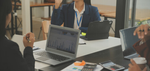 Business team meeting working with new startup project, discussion and analysis data the charts and...