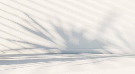 a soft white background for product presentation with the shadow of a plant and blinds cast on the...