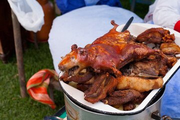 Forography of fried guinea pig in a local fair in Peru. Concept of Peruvian food and traditions.