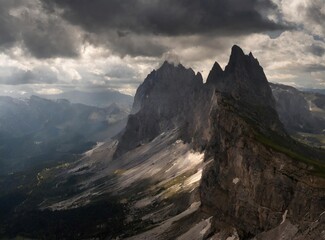 View of moody mountain peaks in the Dolomites, Italy