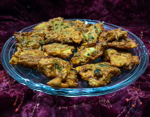 A plate filled with crispy and tasty Pakora - Street Food
