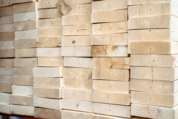 Full stack of 2 by 6 pine spruce woods framing studs building construction material on shelves at...