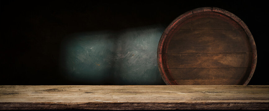 table background of free space for your wine bottle or food on top and dark retro interior of barrels . High quality photo