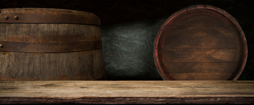table background of free space for your wine bottle or food on top and dark retro interior of barrels . High quality photo
