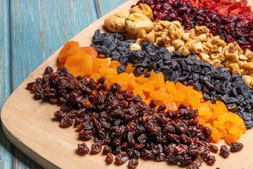 Dried fruits arrangement includes raisins, goldenberries, figs, and apricots, presenting a vibrant and nutritious array