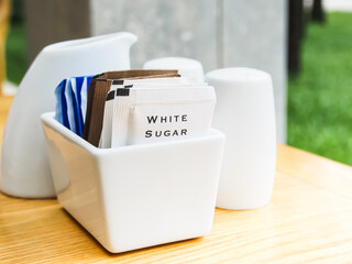 packets of white sugar.
