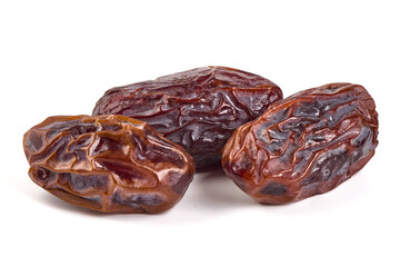Raw Organic Medjool Dates, isolated on white background.