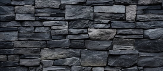 Background of stone blocks on a black wall - obrazy, fototapety, plakaty