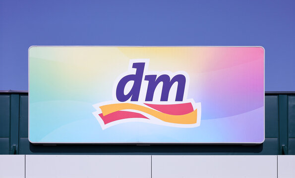 Grodzisk Wlkp., Poland - March 8, 2024. The logo of dm Drogerie Markt, usually abbreviated as "dm", a chain of retail stores offering cosmetics, health food, healthcare and household products.