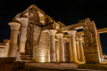 Ancient egyptian temple of Kom Ombo on the Nile river bank illuminated at night, Egypt - 753695144