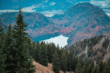An overhead view of the mountain lake panorama amidst the fall forest and mountains
