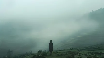 Gordijnen Person Standing Alone in a Foggy Landscape Ominous Vibe © vanilnilnilla