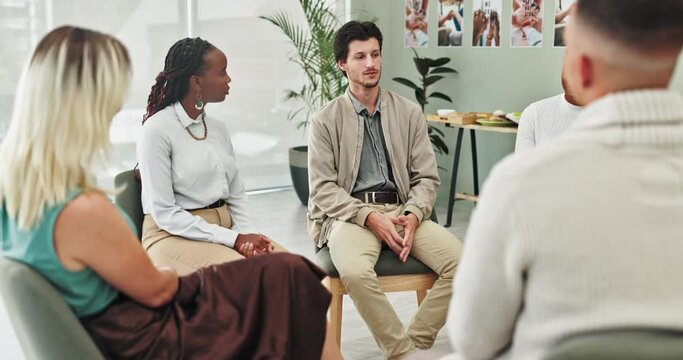 People, group therapy and man in circle at meeting with listening, advice and empathy with kindness. Communication, women and conversation for psychology, support or consultation with chair in huddle