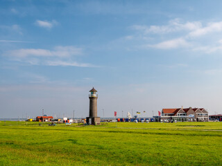 Fototapeta na wymiar Lighthouse Memmertfeuer on Juist island, East Frisia, Lower Saxony, Germany