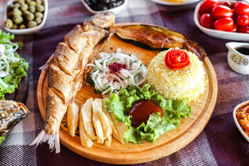 Wooden Plate Overflowing With a Variety of Delicious Food