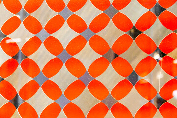 Orange decorative translucent glass with a diamond pattern.
