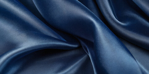 Fototapeta premium Luxurious black smooth silk or satin texture background. Black silk wave and curve background