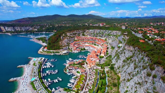 Portopiccolo Sistiana - Italy - Gulf of Trieste - fantastic flight aerial view backwards from the seaside resort with marina in a rocky bay