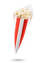 Popcorn in red and white striped paper cone, isolated on white background.