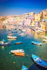 Schilderijen op glas Procida island colorful town with harbor, Italy © neirfy