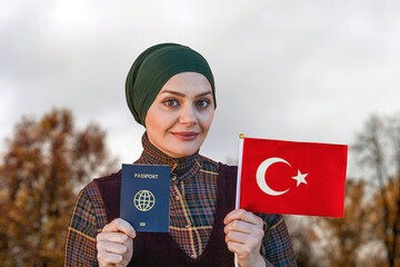 Muslim Woman Holding Passport and Flag of Turkey
